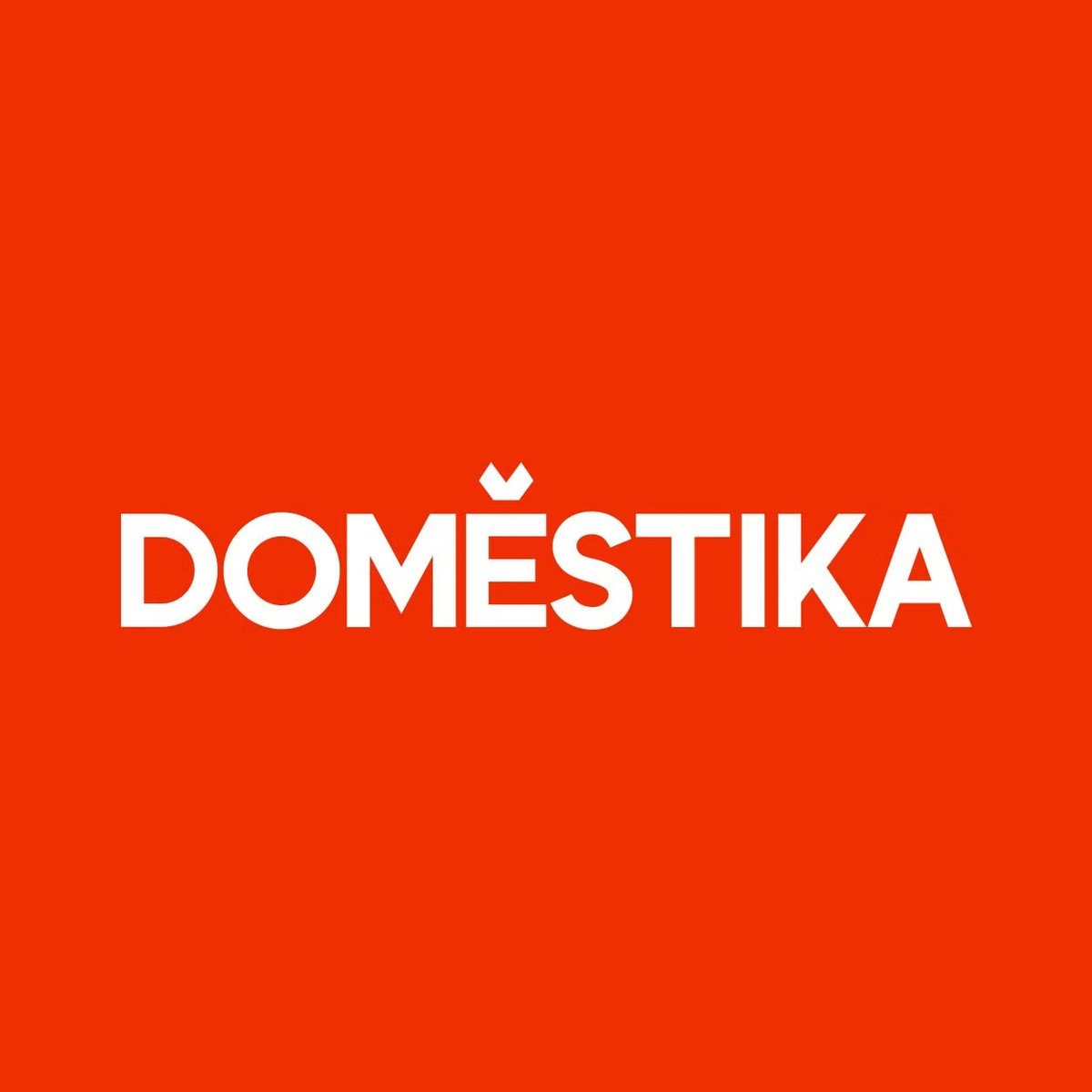 Domestika logo in white on a red background